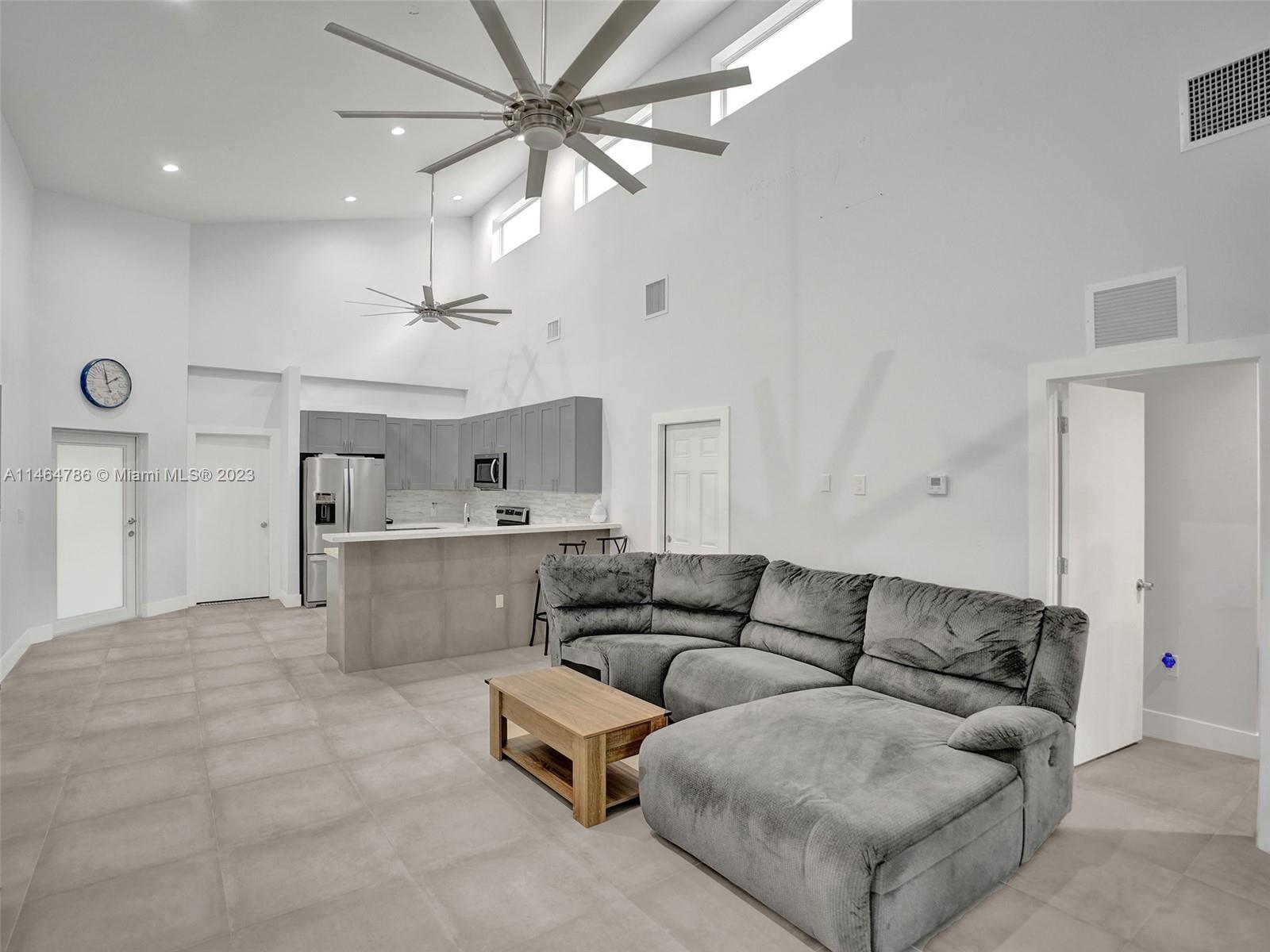1543 Southwest 32nd Street Fort Lauderdale, FL 33315 - Photo 11 of 33 a living room with furniture and a ceiling fan