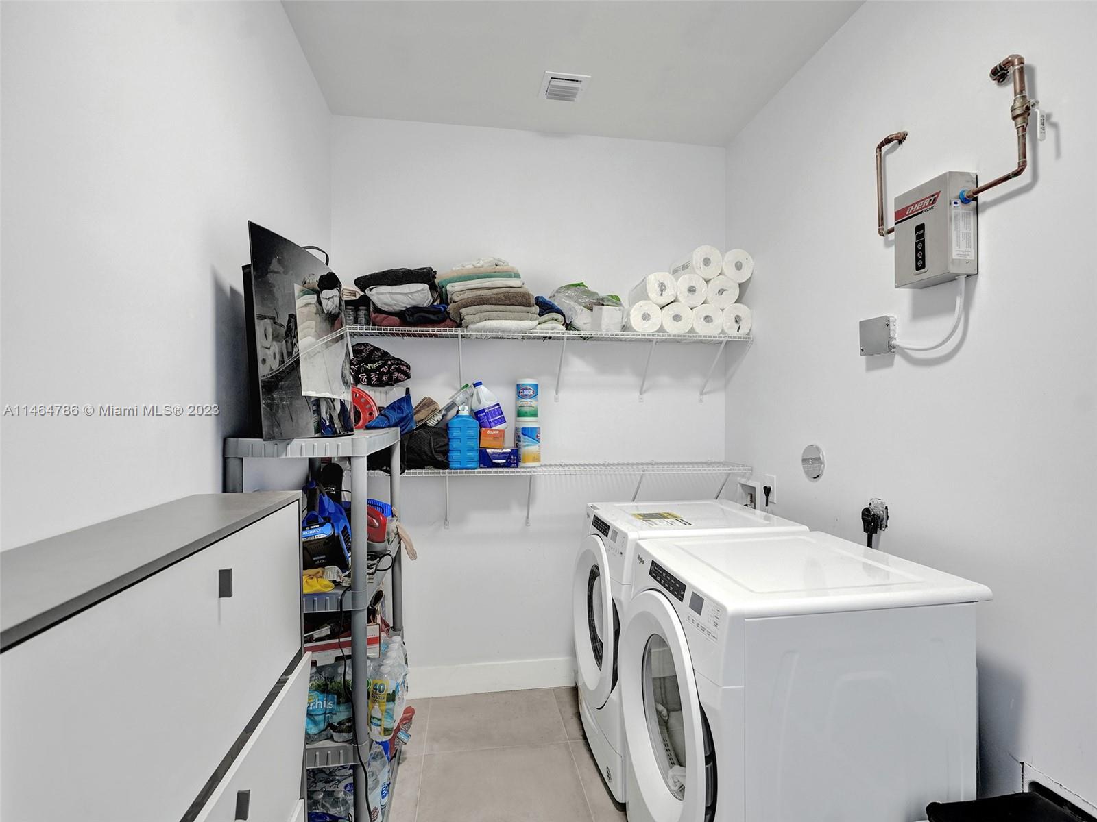 1543 Southwest 32nd Street Fort Lauderdale, FL 33315 - Photo 21 of 33 a utility room with dryer and washer