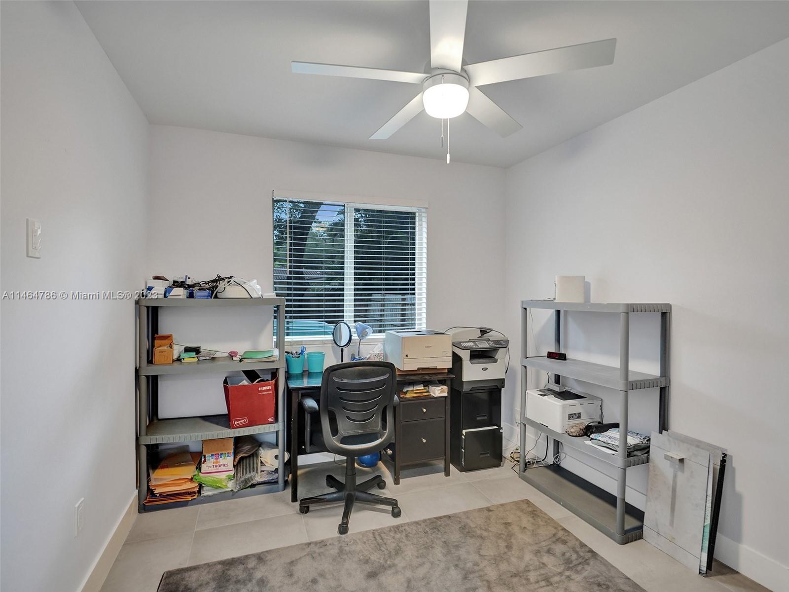 1543 Southwest 32nd Street Fort Lauderdale, FL 33315 - Photo 22 of 33 a view of a workspace with furniture and a window