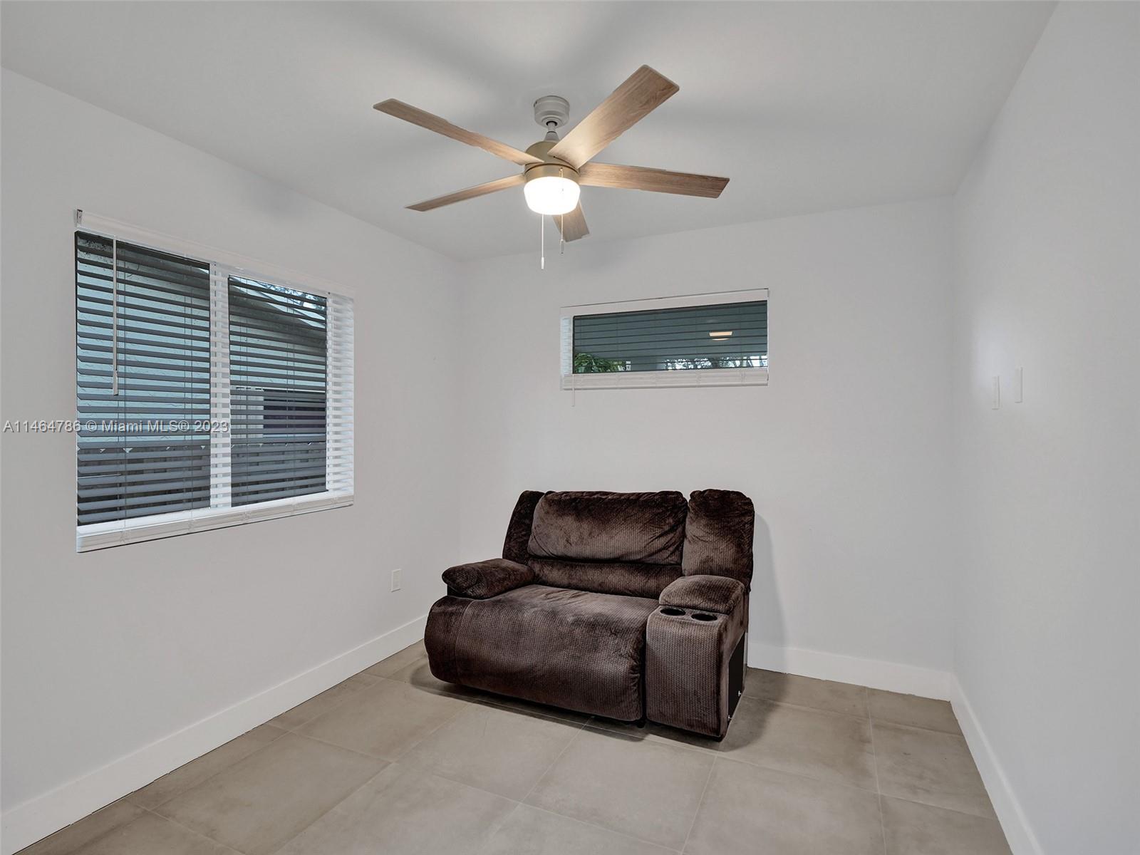 1543 Southwest 32nd Street Fort Lauderdale, FL 33315 - Photo 24 of 33 a living room with furniture and a window