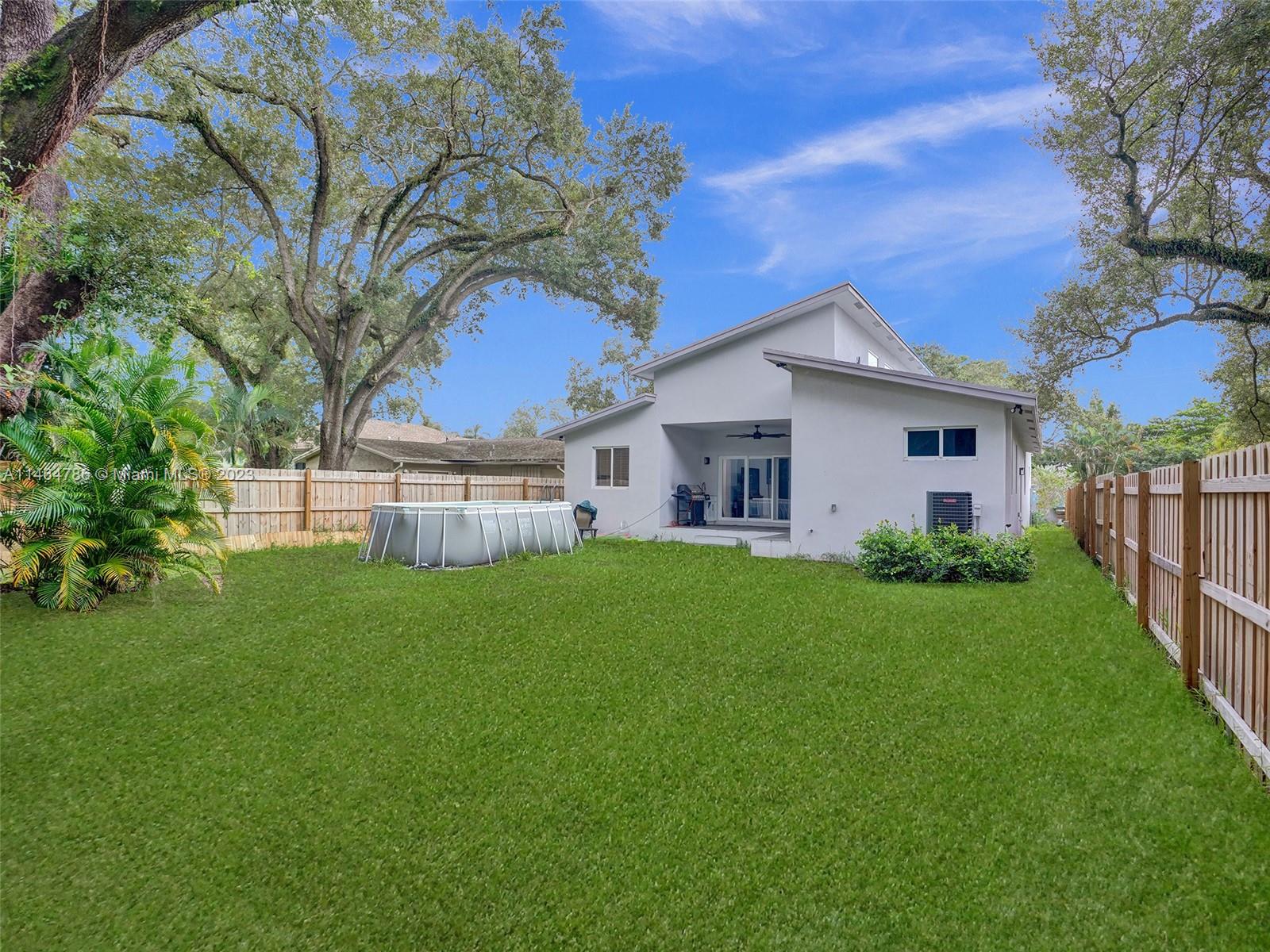 1543 Southwest 32nd Street Fort Lauderdale, FL 33315 - Photo 30 of 33 a view of a house with backyard and garden