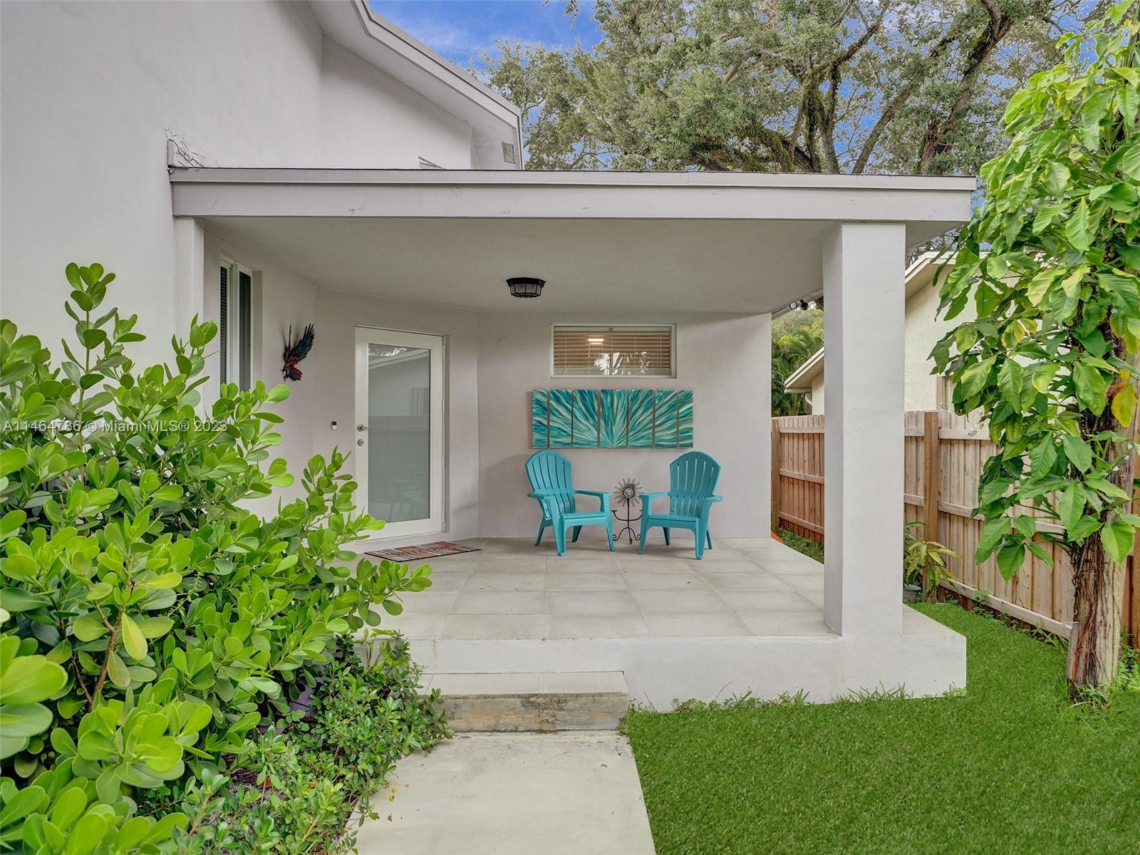 1543 Southwest 32nd Street Fort Lauderdale, FL 33315 - Photo 3 of 33 a view of a house with a yard and sitting area
