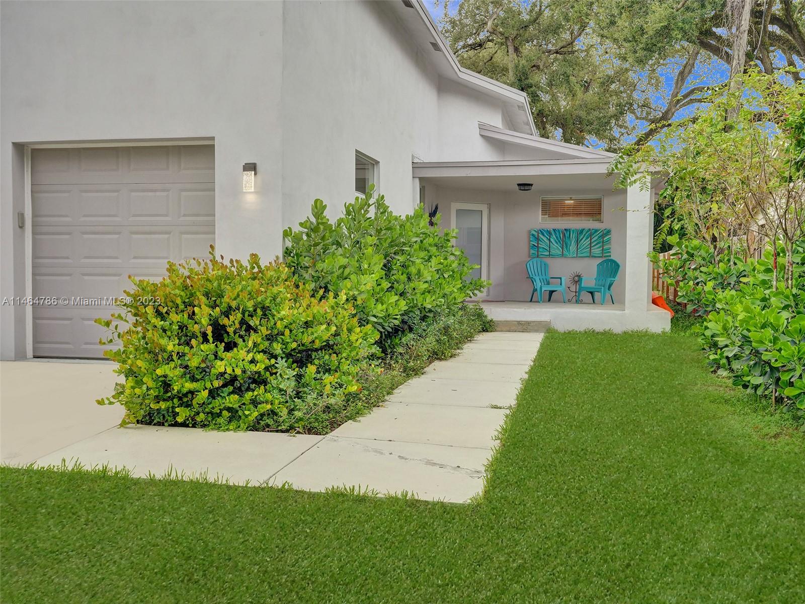1543 Southwest 32nd Street Fort Lauderdale, FL 33315 - Photo 32 of 33 a front view of a house with garden