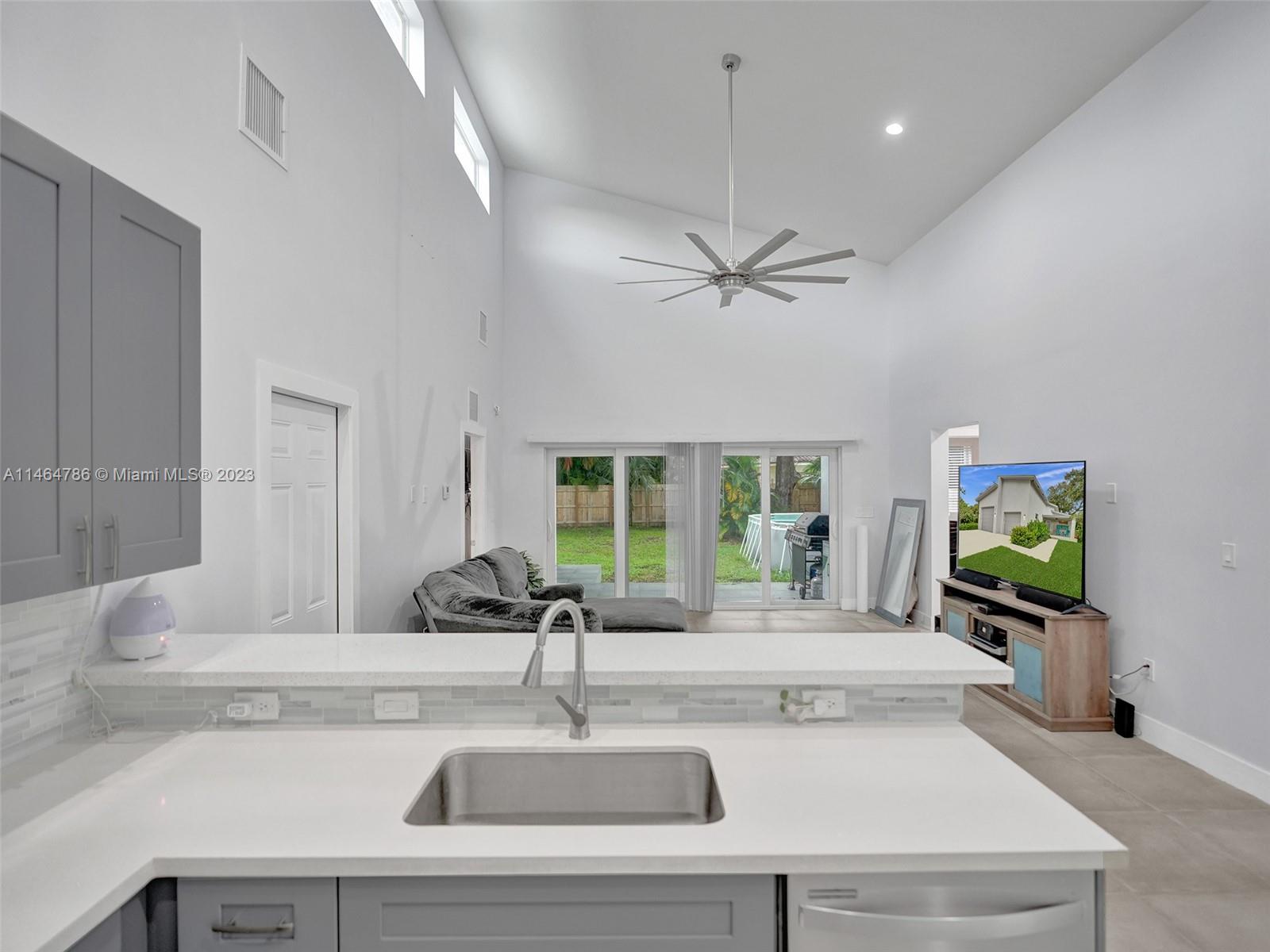 1543 Southwest 32nd Street Fort Lauderdale, FL 33315 - Photo 9 of 33 a kitchen with a sink and a large window