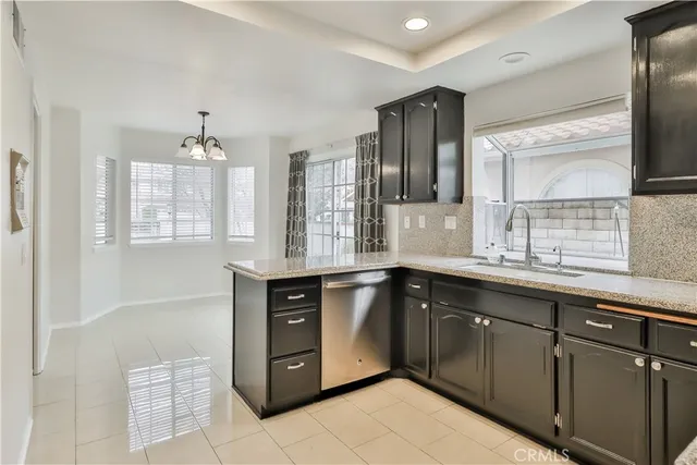 a kitchen with a refrigerator and microwave