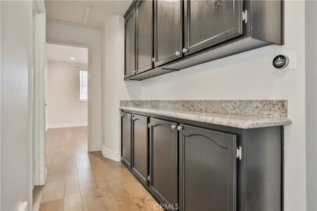 a bathroom with a sink toilet double vanity and shower