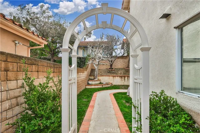 a front view of a house with a yard and a garage