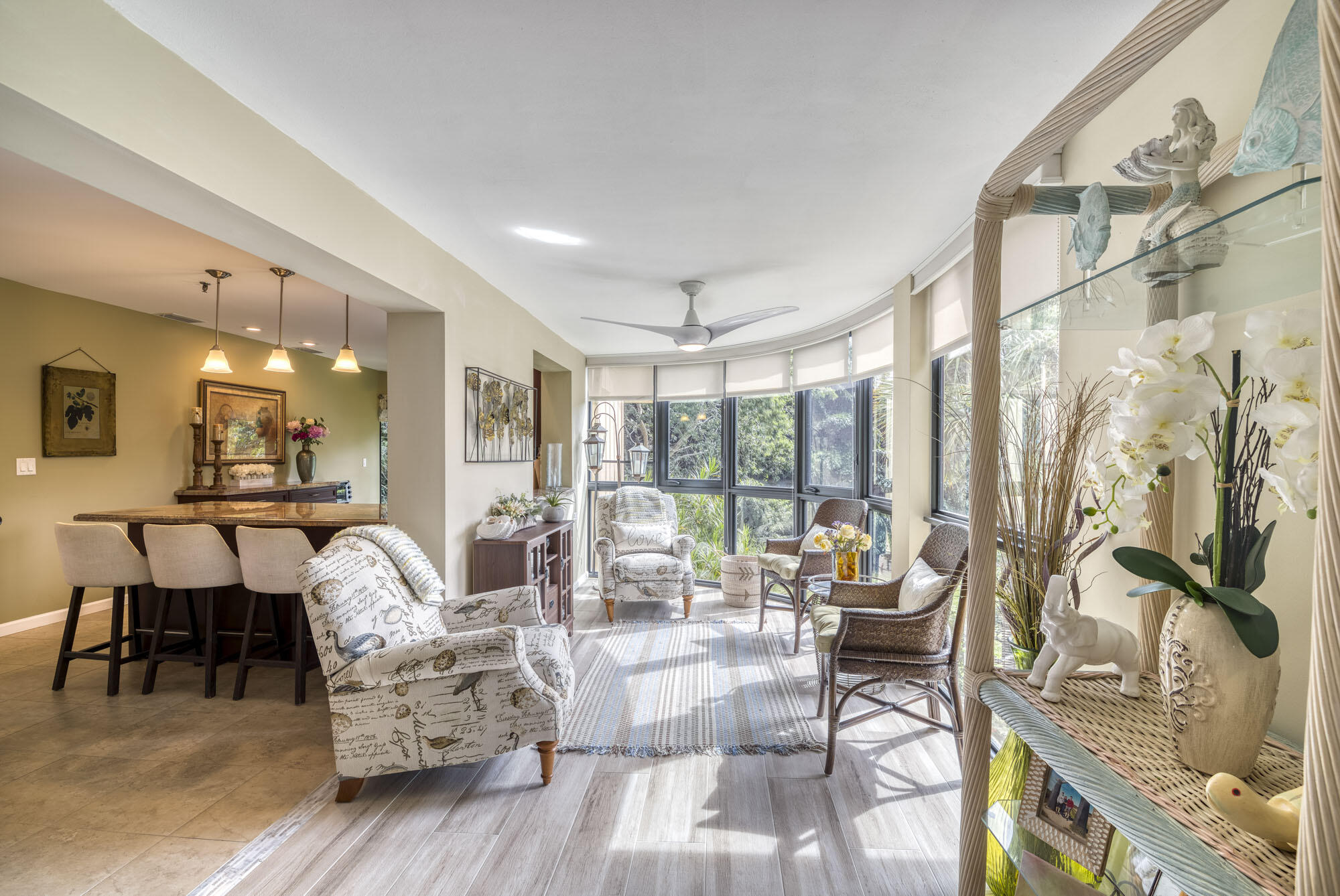 17165 Waterbend Drive, Unit 207 Jupiter, FL 33477 - Photo 14 of 27 a living room with furniture and a large window