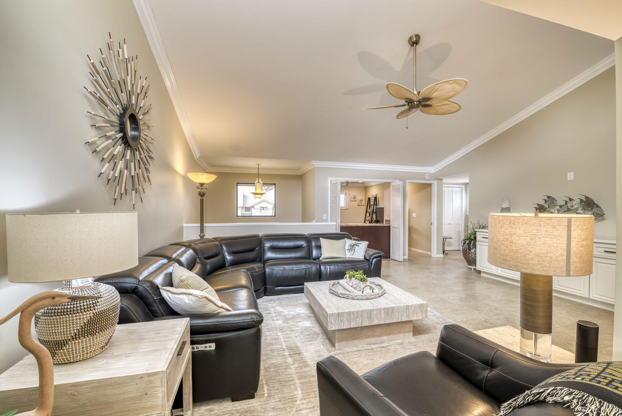 17165 Waterbend Drive, Unit 207 Jupiter, FL 33477 - Photo 2 of 27 a living room with furniture or couch and a chandelier