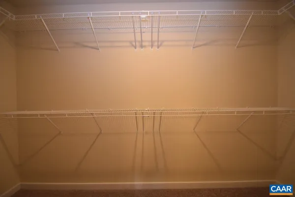 a view of a room with racks on the wall