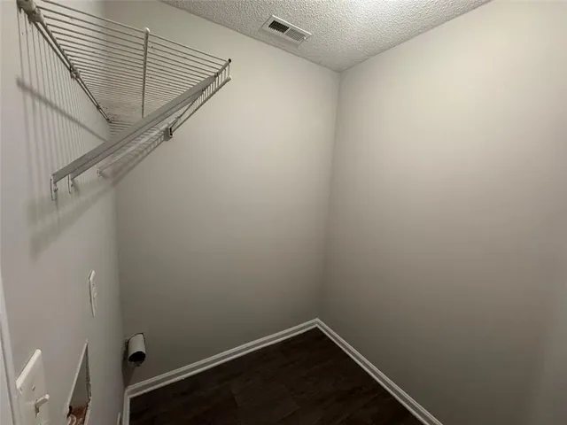 a view of small space with racks on the wall