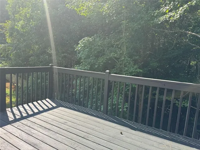 a view of balcony with wooden floor