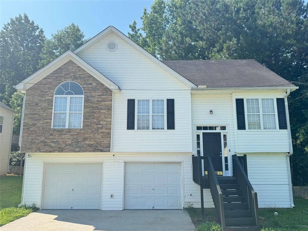 4044 Robin Circle Atlanta, GA 30349 - Photo 2 of 15 a view of a house with a yard