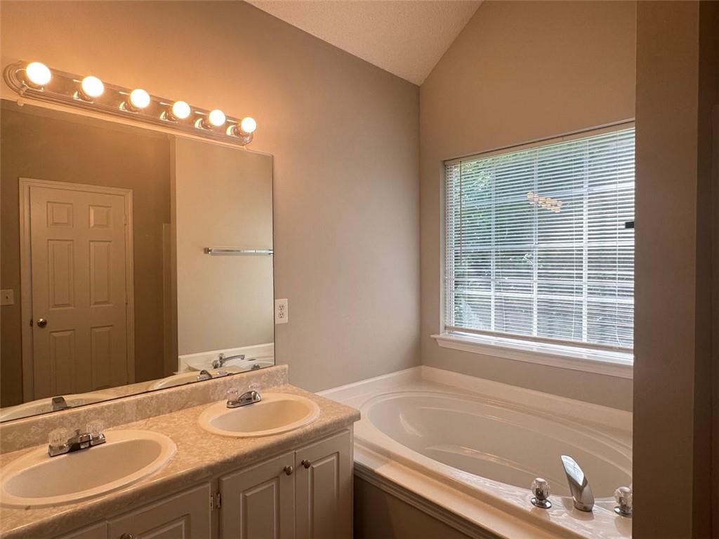 4044 Robin Circle Atlanta, GA 30349 - Photo 8 of 15 a bathroom with a sink and a mirror