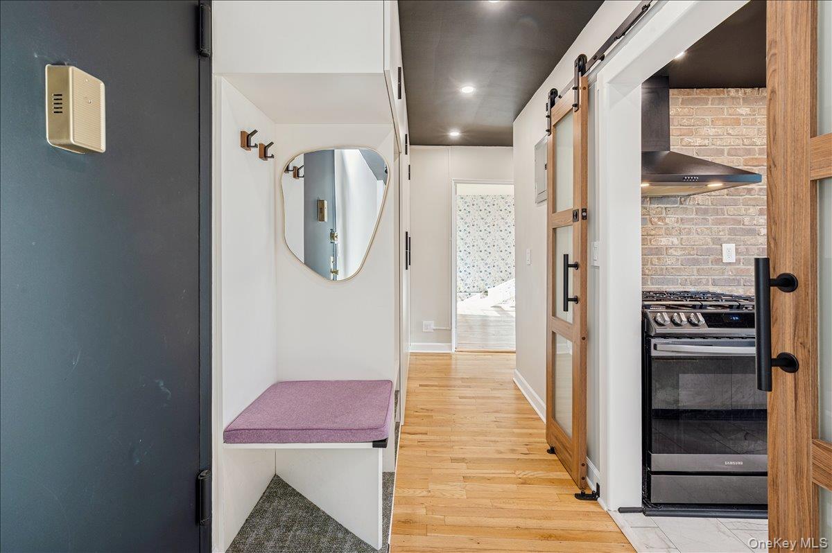 a hallway with a view of living room