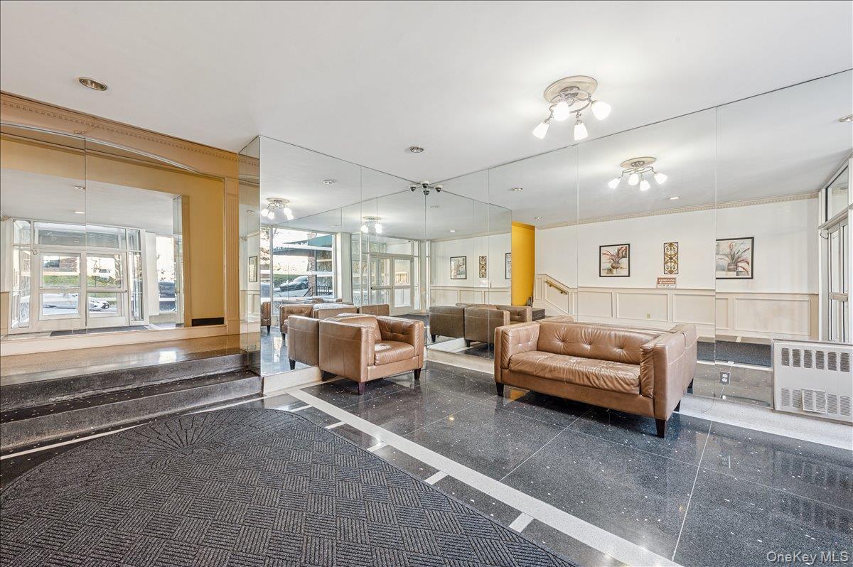 2 Bronxville Road, Unit 8D Bronxville, NY 10708 - Photo 16 of 23 a living room with furniture and a large window