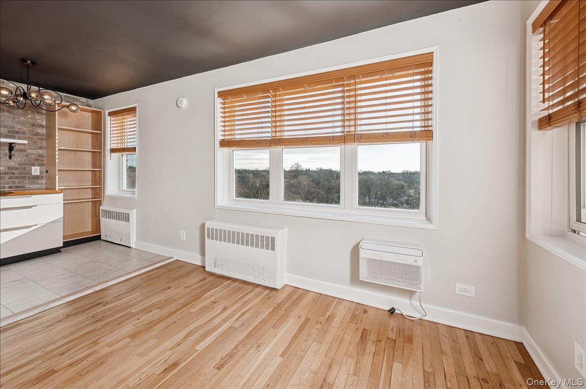 2 Bronxville Road, Unit 8D Bronxville, NY 10708 - Photo 5 of 23 a view of a room with racks on the wall and a window