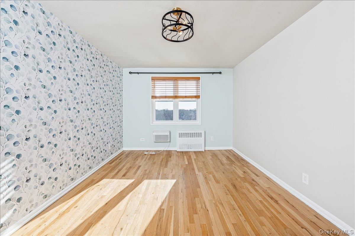 2 Bronxville Road, Unit 8D Bronxville, NY 10708 - Photo 9 of 23 a view of a room with wooden floor and a window