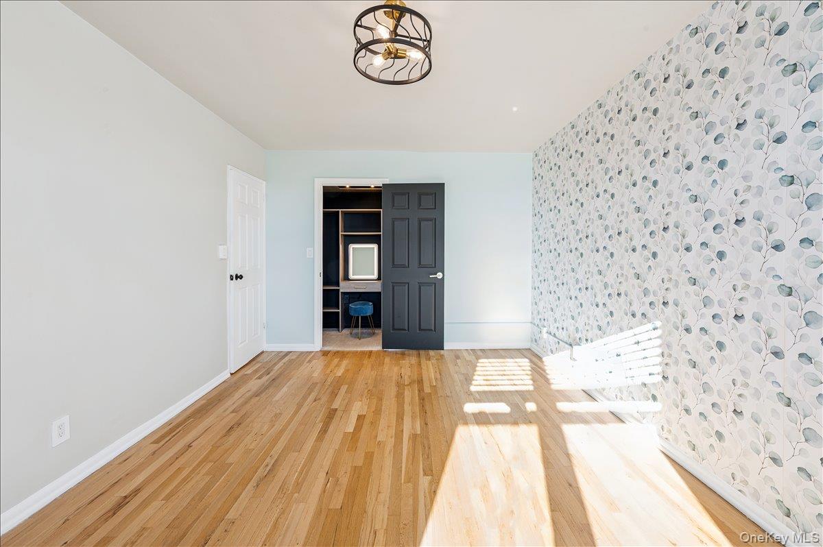 2 Bronxville Road, Unit 8D Bronxville, NY 10708 - Photo 10 of 23 a view of empty room with wooden floor