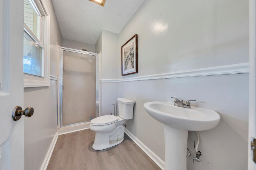 6400 Stewartsville Road Moneta, VA 24121 - Photo 16 of 33 a bathroom with a sink toilet and a mirror