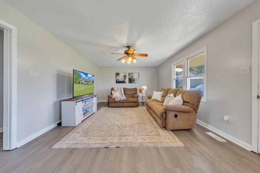 6400 Stewartsville Road Moneta, VA 24121 - Photo 2 of 33 a living room with furniture and a flat screen tv