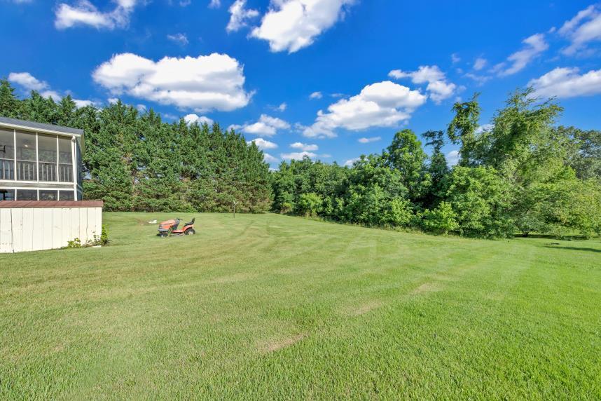 6400 Stewartsville Road Moneta, VA 24121 - Photo 21 of 33 a view of a big yard with an outdoor space and seating area