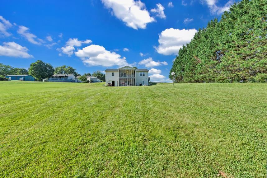6400 Stewartsville Road Moneta, VA 24121 - Photo 22 of 33 a view of a big yard with a house in the background