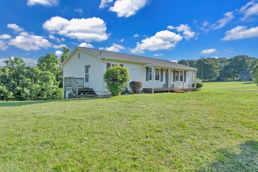6400 Stewartsville Road Moneta, VA 24121 - Photo 25 of 33 a view of a house with backyard and garden