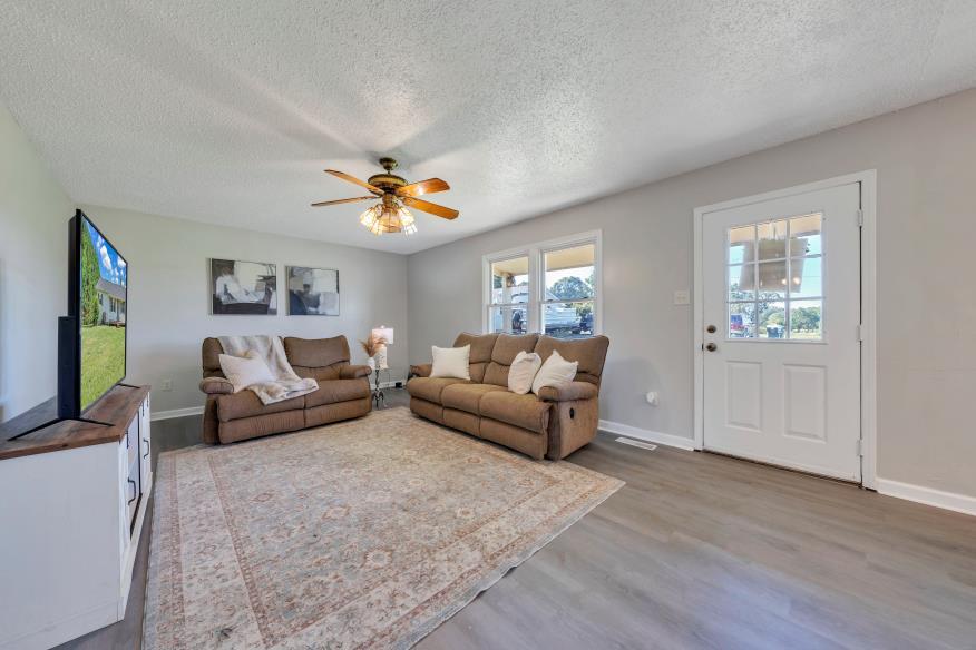 6400 Stewartsville Road Moneta, VA 24121 - Photo 3 of 33 a living room with furniture and a wooden floor