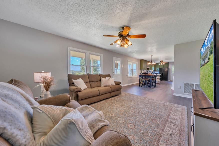 6400 Stewartsville Road Moneta, VA 24121 - Photo 5 of 33 a living room with furniture kitchen view and a window