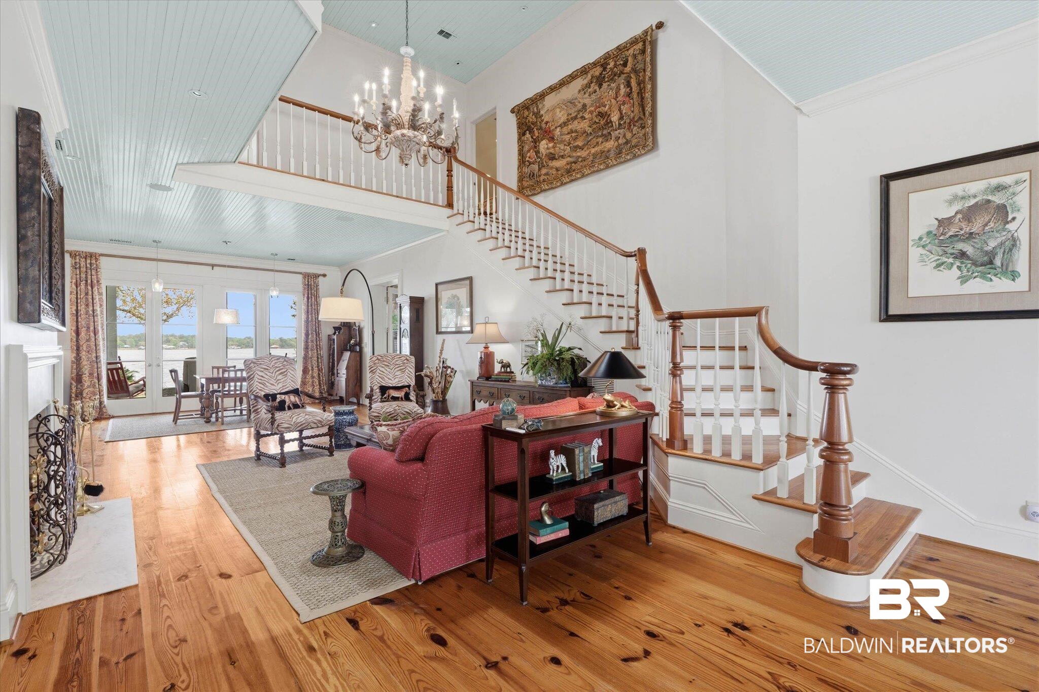 3500 Higgins Road Mobile, AL 36619 - Photo 3 of 54 Living area featuring hanging lights, crown molding, light wood finished floors, and a high ceiling