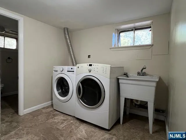 a utility room with dryer and washer