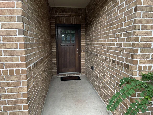 a view of a livingroom from a hallway