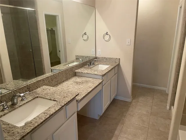 a bathroom with a tub and shower