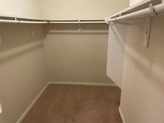 a bathroom with a shower and a glass door
