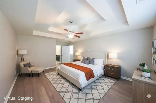 a bedroom with a bed and a lamp on table