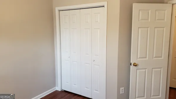 a bathroom with a toilet a sink and shower