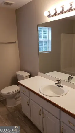 a view of a room with racks on the wall