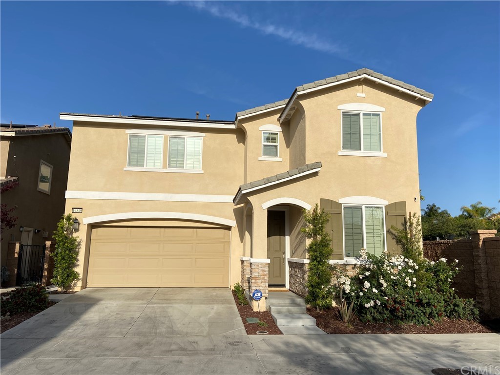 19549 Fortunello Avenue Riverside, CA 92508 - Photo 1 of 1 a front view of a house with garden