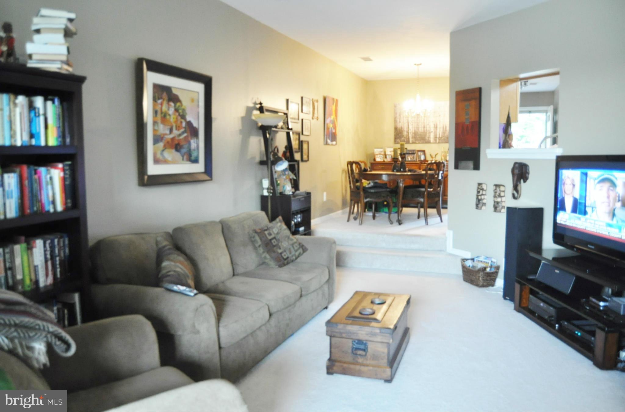 11282 Harbor Court, Unit 11282 Reston, VA 20191 - Photo 14 of 27 Living room with steps up to dining area.