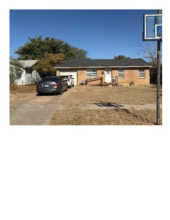 a view of car parked on the side of a street