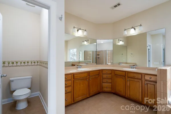 a bathroom with a sink double vanity and a mirror