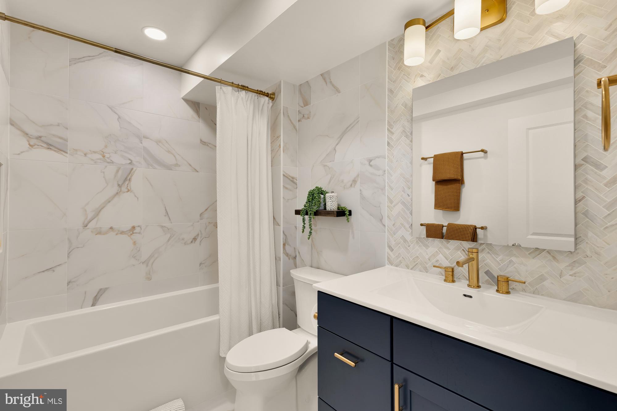 2434 Ontario Road Northwest, Unit 1 Washington, DC 20009 - Photo 14 of 20 Elegant marble bath with modern accents.