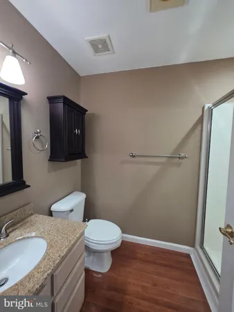 a white toilet sitting next to a bathroom sink