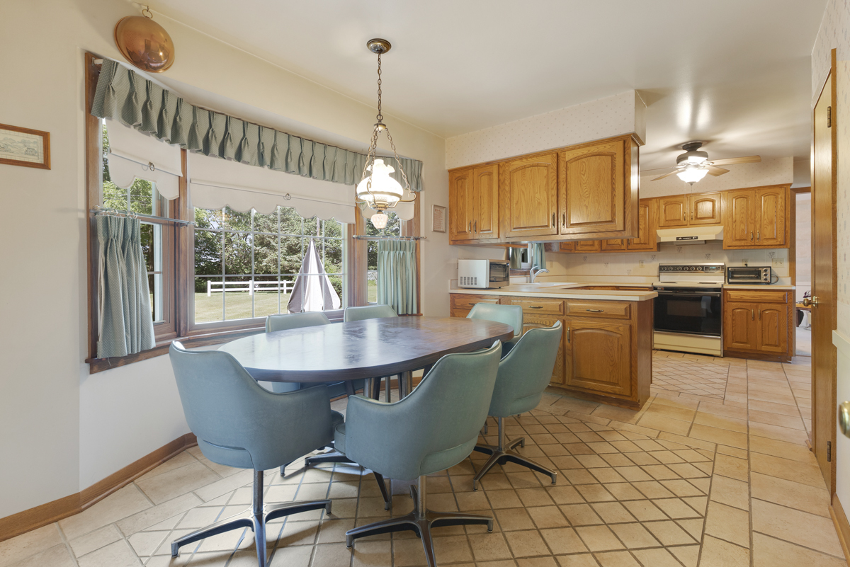 690 Stanford Drive Marengo, IL 60152 - Photo 11 of 30 a dining table chairs and a kitchen view