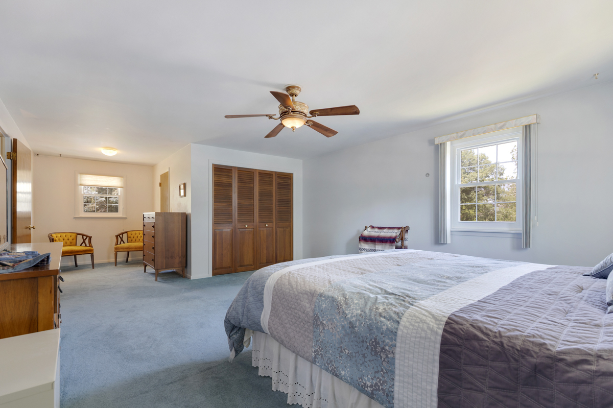 690 Stanford Drive Marengo, IL 60152 - Photo 16 of 30 a bedroom with a bed and ceiling fan