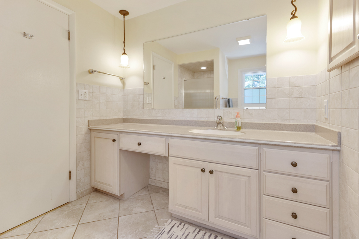 690 Stanford Drive Marengo, IL 60152 - Photo 17 of 30 a bathroom with a sink and a mirror