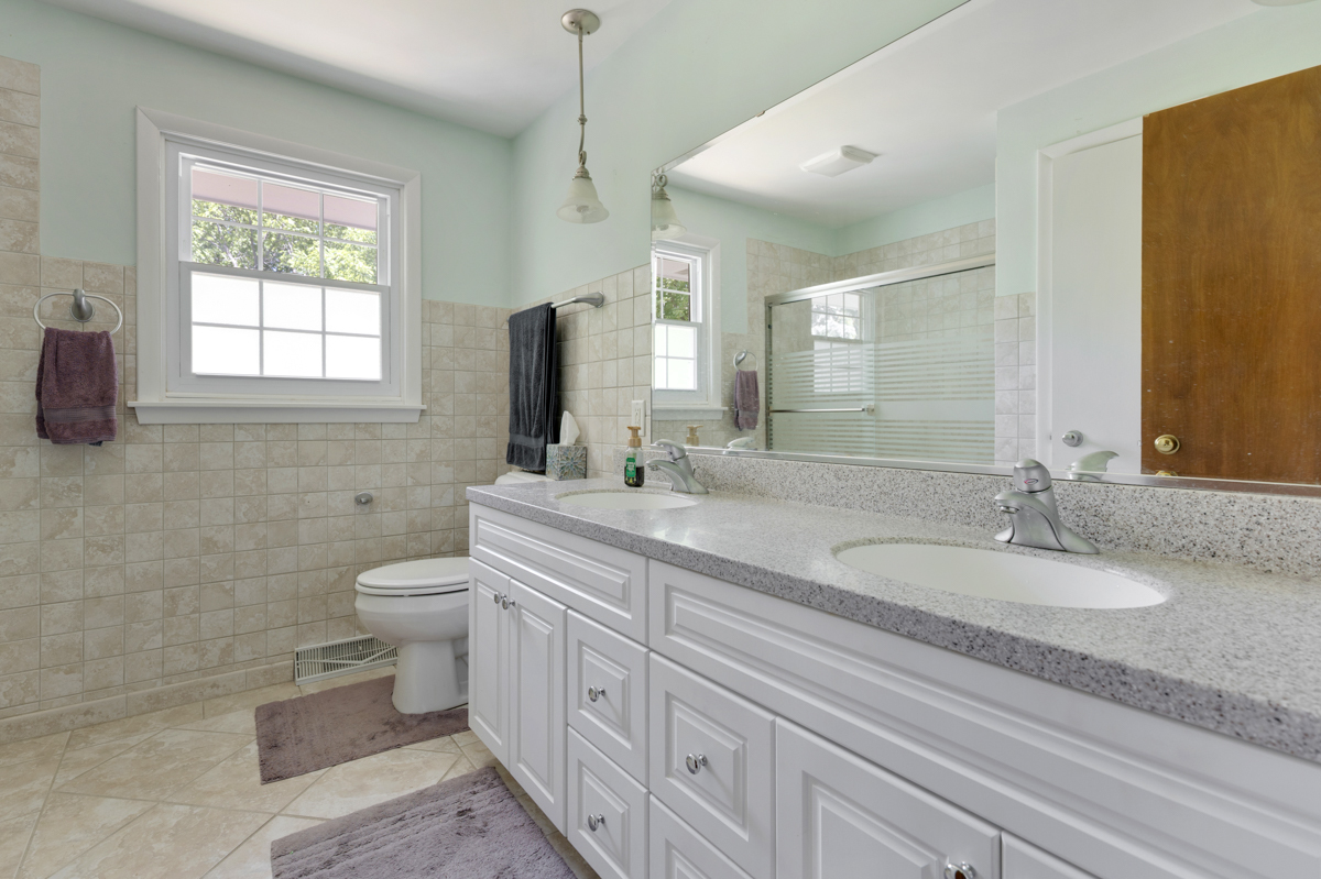 690 Stanford Drive Marengo, IL 60152 - Photo 19 of 30 a bathroom with a granite countertop toilet sink and mirror