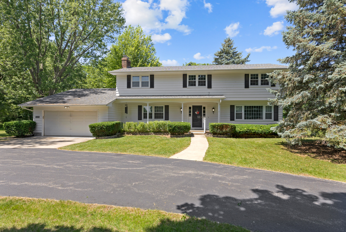 690 Stanford Drive Marengo, IL 60152 - Photo 22 of 30 a front view of a house with a yard and garage