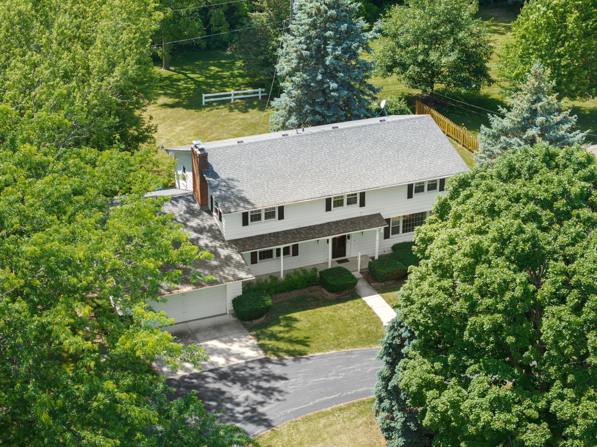 690 Stanford Drive Marengo, IL 60152 - Photo 23 of 30 an aerial view of a house with a yard large trees and plants